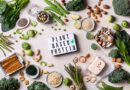 Variety of healthy vegan, plant based protein source and body building food. Tofu soy beans tempeh, green vegetables, nuts, seeds, quinoa oat meal and spirulina. View from above